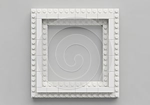 Square frame constructed from interlocking white plastic bricks resembling LEGO. The frame is