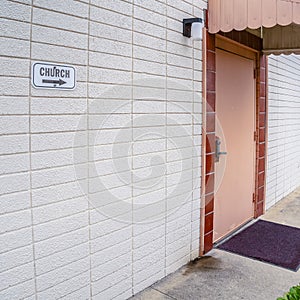 Square frame Covered entrance door in a modern white building