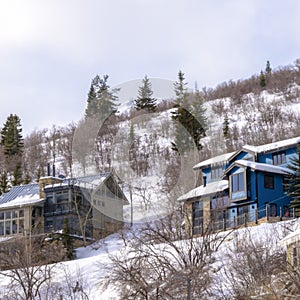 Square frame Homes on residential mountain neighborhood in snowy Park City Utah in winter