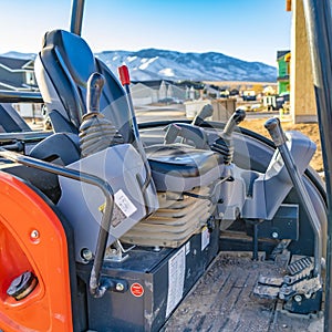 Square frame Interior of the open cab of a heavy duty construction machinery