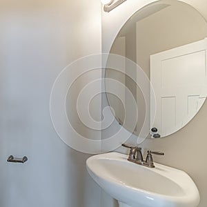 Square frame Interior of a small white bathroom with sink and mirror