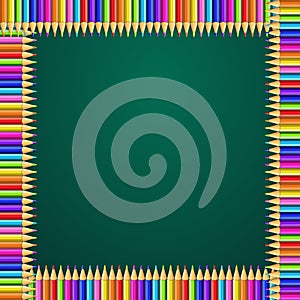 Square frame made of colorful rainbow pencils on green blackboard background