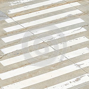 Square frame Pedestrian crossing white lines painted on the road in front of building
