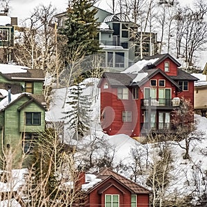 Square frame Scenic winter landscape with colorful houses built on the snowy mountain slope