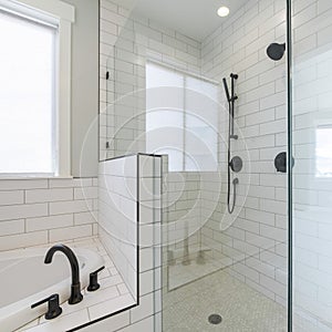 Square frame Shower stall with tiles and cohesive plumbing fixtures