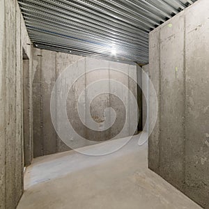 Square frame Unfinished empty cold storage room in a basement of a house