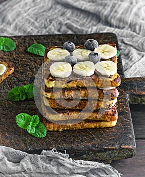 Square fried bread slices with chocolate and banana