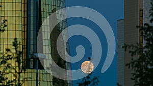 A square in front of Ak Orda with Altyn Orda business center timelapse with full moon.