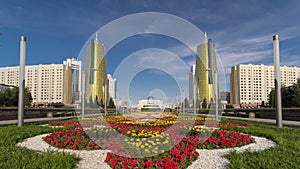 A square in front of Ak Orda with Altyn Orda business center timelapse hyperlapse in the foreground.