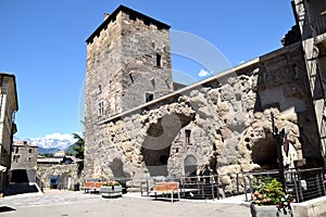 The square in front of the ancient Roman and medieval walls of the door to the city of Aosta - Italy