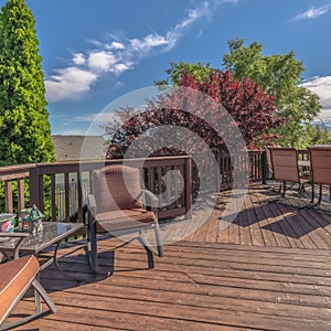 Square Furniture on the balcony of home with brown wooden floor railing and stairs