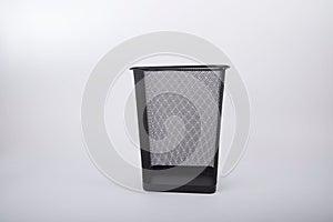 Square garbage can isolated on a gray background