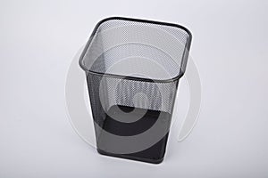 Square garbage can isolated on a gray background