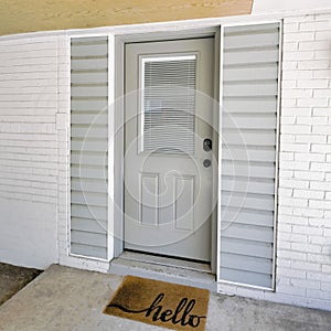 Square Gray front door of a home with digital entry keypad