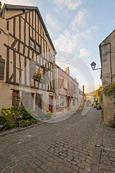 Square with half-timbered houses, in the medieval village Noyers-sur-Serein