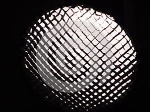 A square honey-combed grid continuous lighting flash soft box diffuser modifier installation