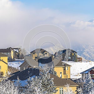 Square Houses on snow covered Wasatch Mountain setting on a sunny winter day