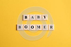 Square letters with text BABY BOOMER isolated on yellow background