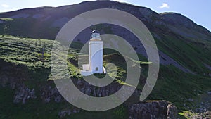 A Square Lighthouse on a Cliff Edge Aerial View