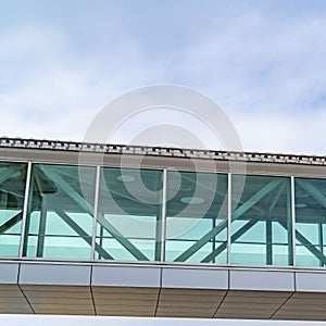 Square Looking up at an empty skybridge with a cloudy blue sky in the background