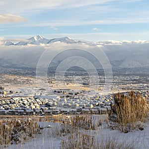 Square Mountain and residential neighborhood in Utah Valley on a snowy winter day