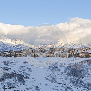 Square Mountainside residential community of Draper in Utah covered with snow