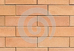 Square orange brick wall.