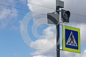 Square pedestrian crossing road sign blue and yellow..