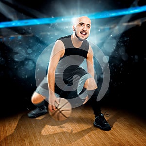 Square photo of basketball player in action dribbles in the gam