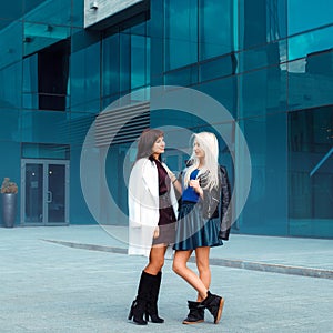 Square photo of two beautiful ladies outdoors