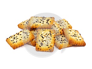 Square poppy seeds and sesame crackers isolated on white