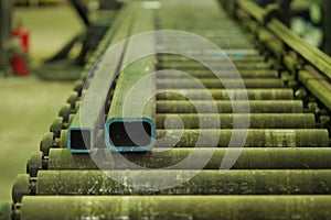 Square and rectangular pipe on a roler bed