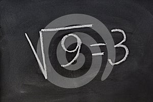 Square root written on a blackboard photo