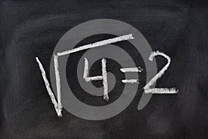 Square root written on a blackboard photo