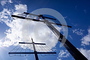 Square sail mainmast against the sun in a children`s game