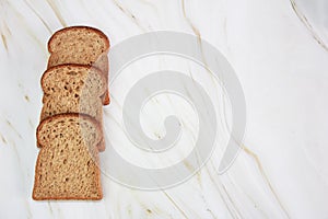 Square slices of toasted dark rye bread