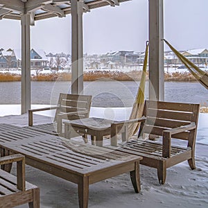 Square Snowy patio of a clubhouse overlooking Oquirh Lake