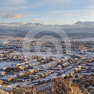 Square Sunset in Utah Valley with homes on a snowy neighborhood with mountain view