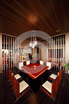 Square table and chairs in empty restaurant