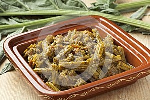 Square tajine with meat and cardoon meal photo