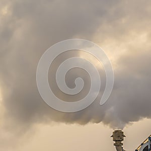 Square Thick steam emitted from the smokestack of a Power Plant in Utah Valley