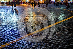 Square, with wet paving stones and walking people, spring city landscape, Moscow