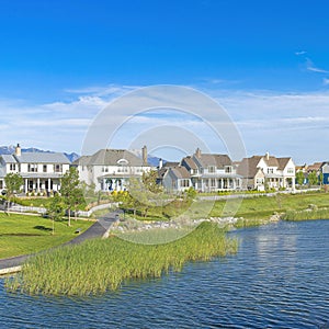 Square Whispy white clouds Panoramic view of a peaceful residential area at Daybreak, Utah