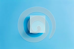 A square of white paper on a blue background