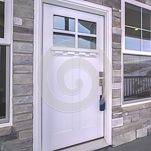 Square White wooden front door with sash windows