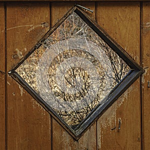 A square window on an old door