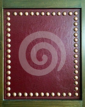 Square Wooden Frame with Luxury Red Leather and Group of Golden Metal Buttons with Copy Space on Red Leather used as Template