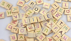 Square wooden tiles with English alphabet scattered  with space for text.word life