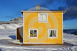 Square yellow house in Norway