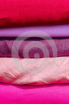 Squares of cloth of red and purple colors